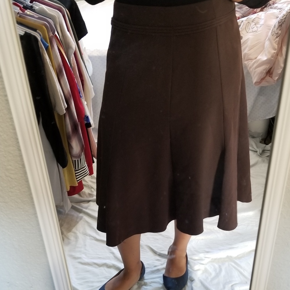Brow and black skirt